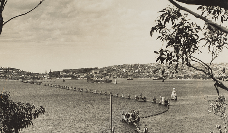 Defensive boom net across Sydney Harbour in the 1940s. Credit and &copy; Australian War Memorial