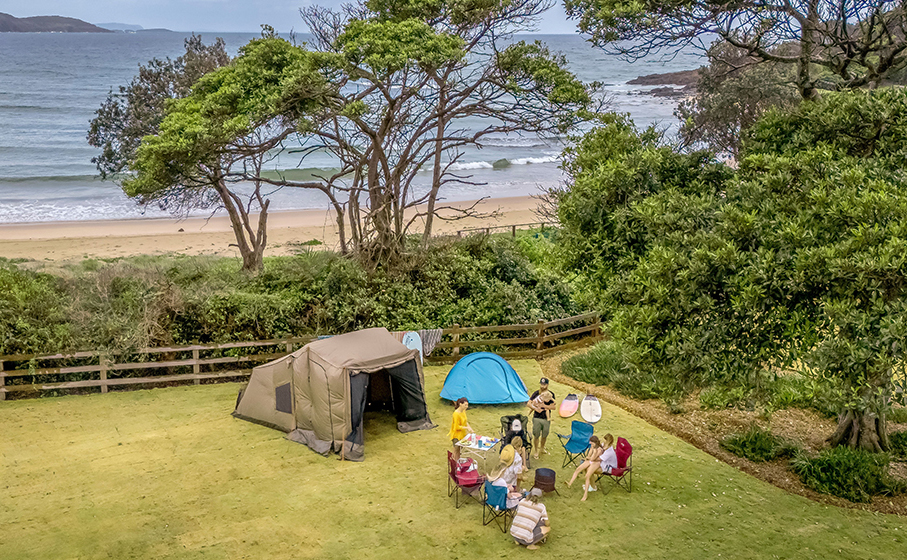 A family camping at Point Plomer campground, just behind the beach. Credit: John Spencer &copy; DCCEEW