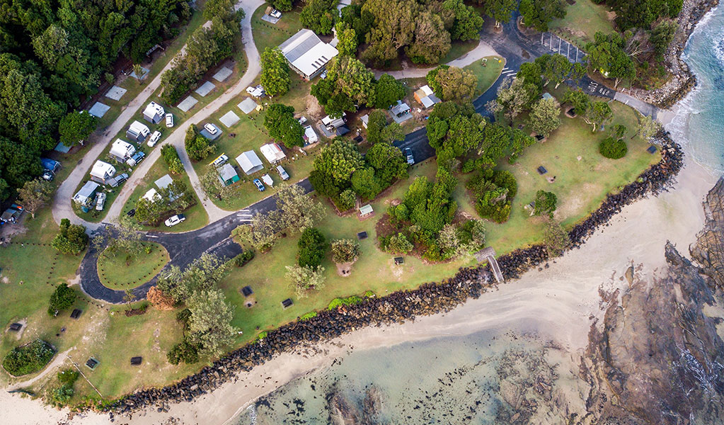 Aerial view of Woody Head campground and adjoining beach, Bundjalung National Park. Credit: John Spencer &copy; DCCEEW