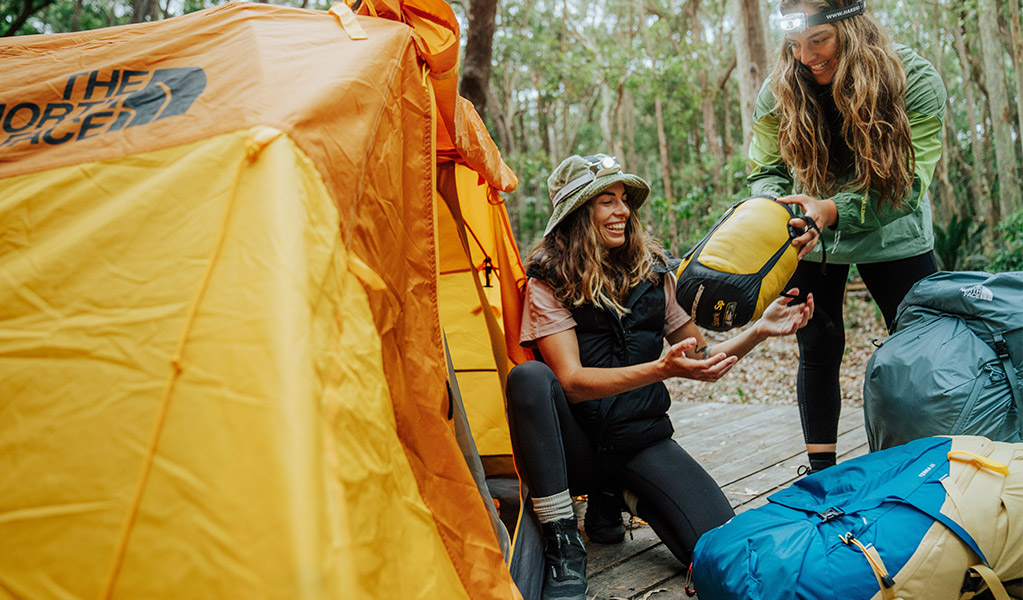 Campers setting up their tent at Depot Beach campground. Credit: Remy Brand/DCCEEW &copy; Remy Brand