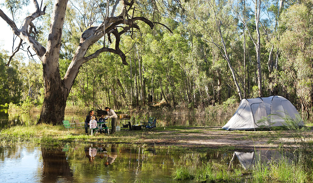 A family camping beside Edward River in Murray Valley National Park. Credit: David Finnegan &copy; DCCEEW