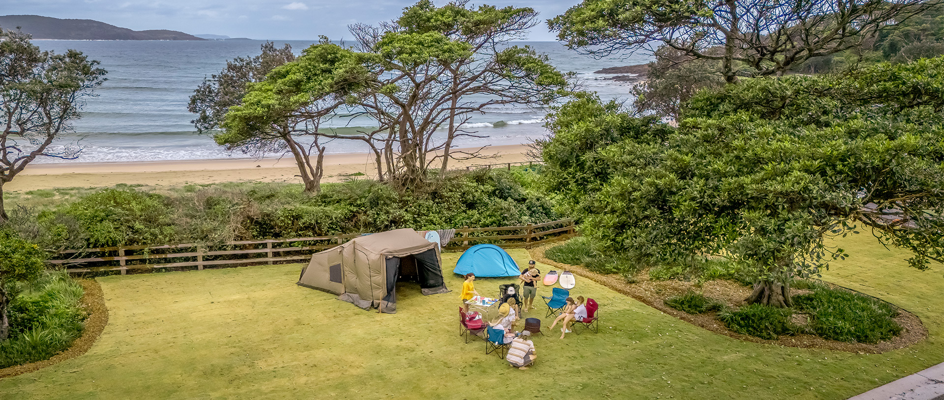 A family camping at Point Plomer campground, just behind the beach. Credit: John Spencer &copy; DCCEEW