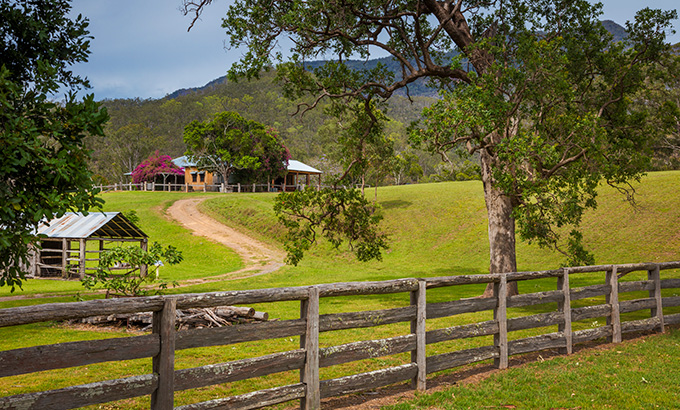 East Kunderang Homestead behind a fance surrounded by green landscape and bush. Gerhard Koertner &copy; Gerhard Koertner