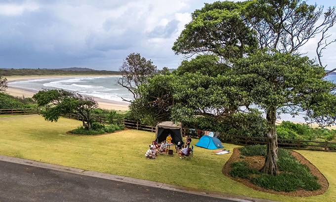 A family camping at Point Plomer campground, just behind the beach. Credit: John Spencer &copy; DCCEEW