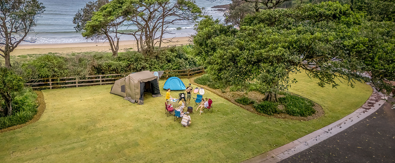 A family camping at Point Plomer campground, just behind the beach. Credit: John Spencer &copy; DCCEEW