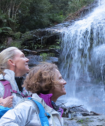 Two women viewing a waterfall on a luxury Blue Mountains trekking trip with Girl. Credit: Helen Lucas &copy; GirlsTrek