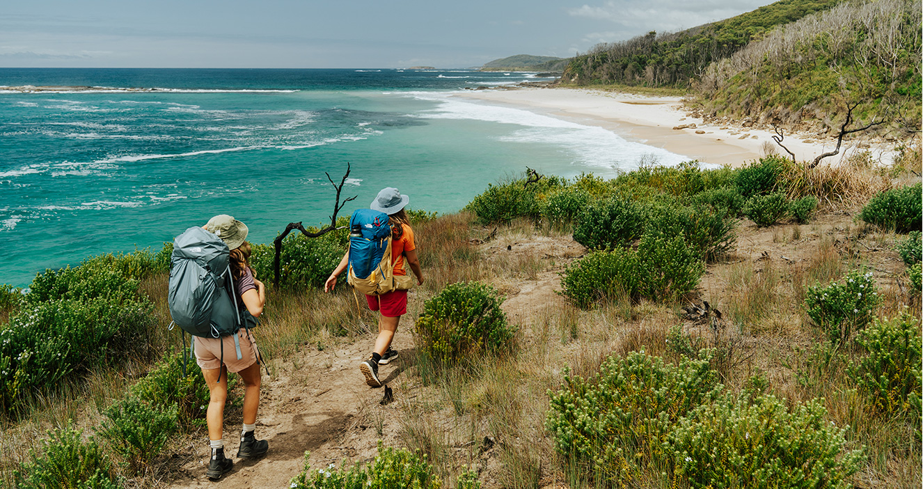 2 walkers on the Murramarang South Coast Walk. Credit: Remy Brand/DPE &copy; Remy Brand