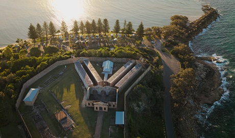 Aerial view of Trial Bay Gaol and the waterfront campsites. Credit: Glen Ellis &copy; DCCEEW