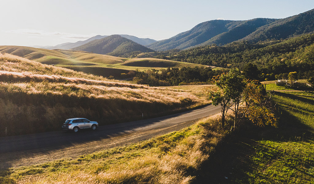 A car pictured driving along the scenic Thunderbolts Way, outside of Gloucester. Credit: Guy Williment  &copy; Destination NSW
