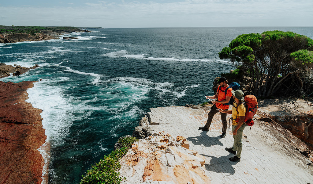 Hikers standing on Pulpit Rock in Beowa National Park. Credit: Remy Brand/DCCEEW &copy; Remy Brand