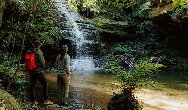2 walkers on Pool of Siloam walk admiring the waterfall's base. Photo: Remy Brand &copy; Remy Brand