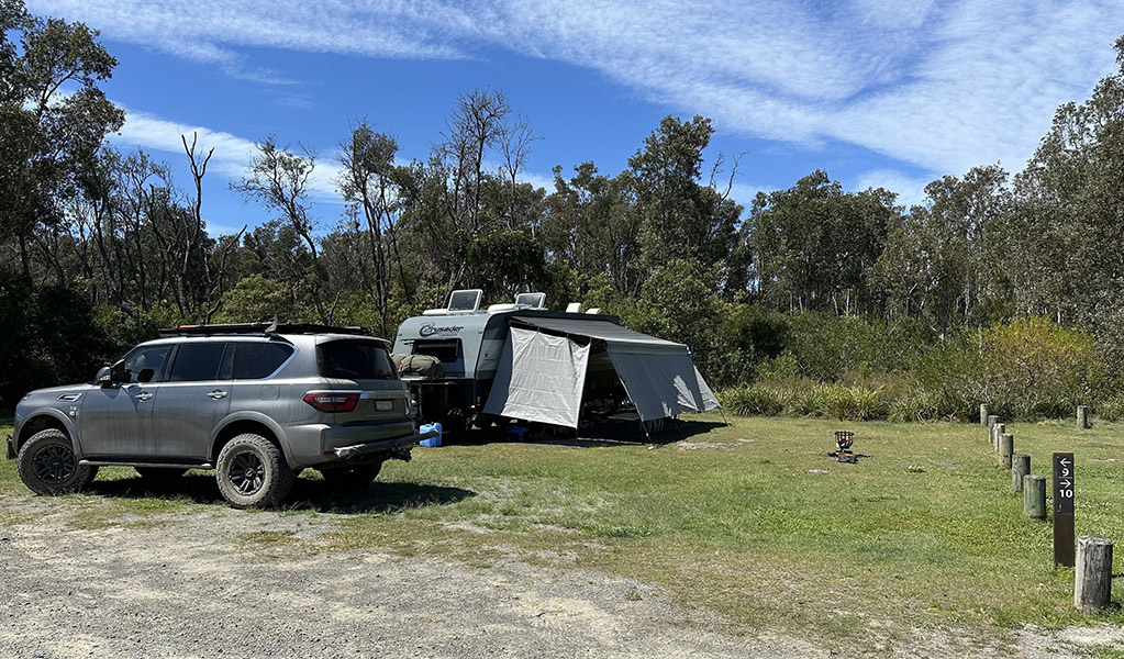 A tent setup next to vehicle at Crowdy Gap campground. Credit: &copy; DCCEEW