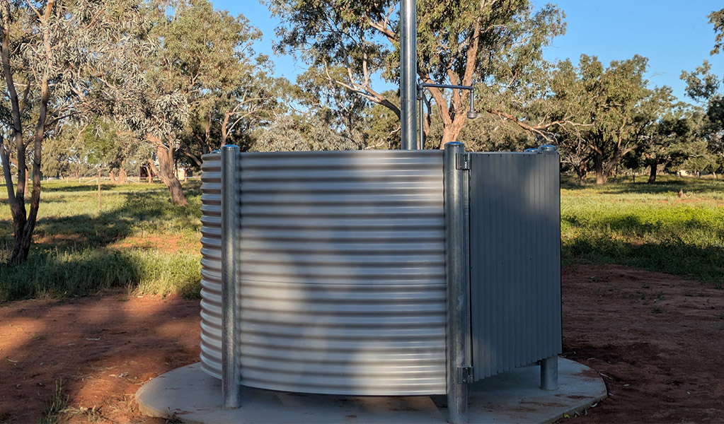 The open air artesian shower at Comeroo campground. Credit: Jessica Stokes &copy; DCCEEW