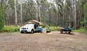 A camper trailer and picnic bench at Boundary Falls campground. Credit: Leah Pippos &copy; DCCEEW