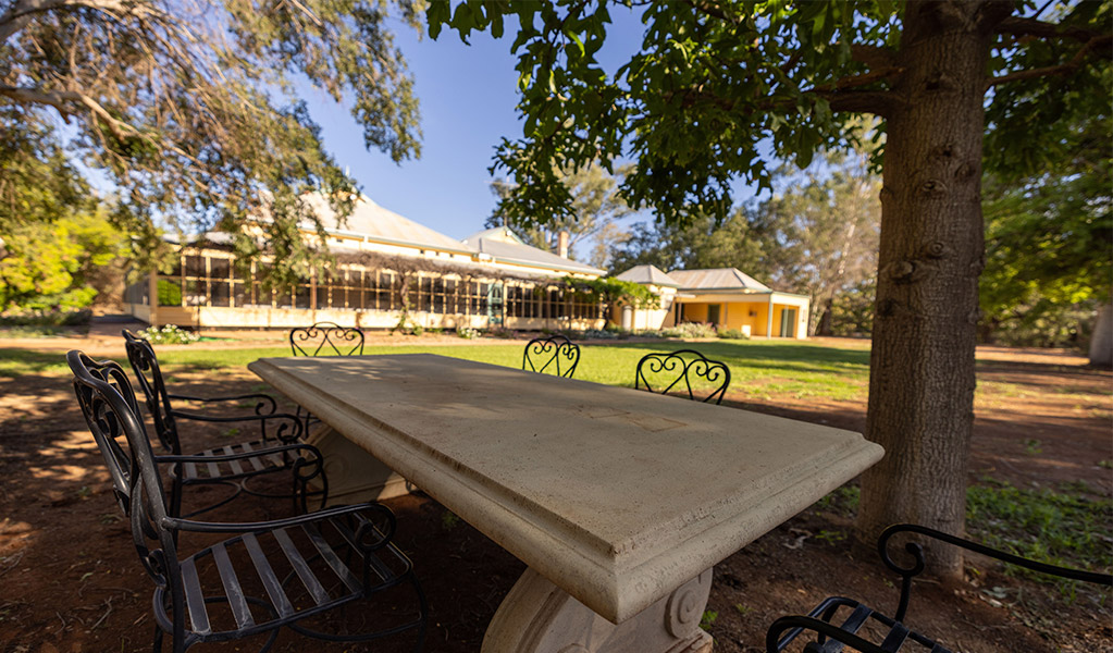 Outdoor table and furniture on the grounds of Hamilton Park Homestead. Credit: Andrew Hull &copy; DCCEEW