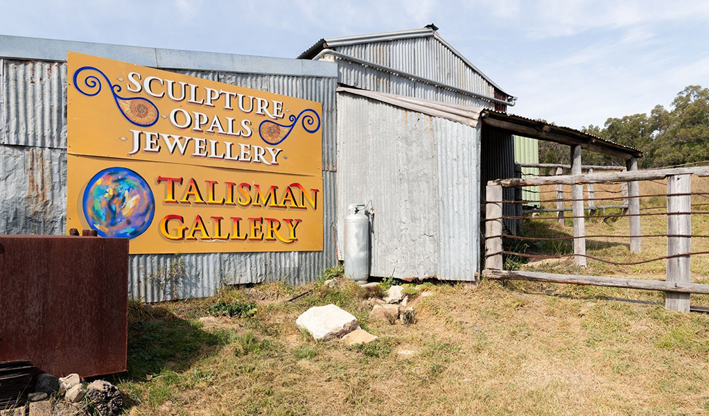 The shed shop front and sign of the Talisman Gallery in Hartley Historic Site. Credit: Ben Pearse &copy; DCCEEW