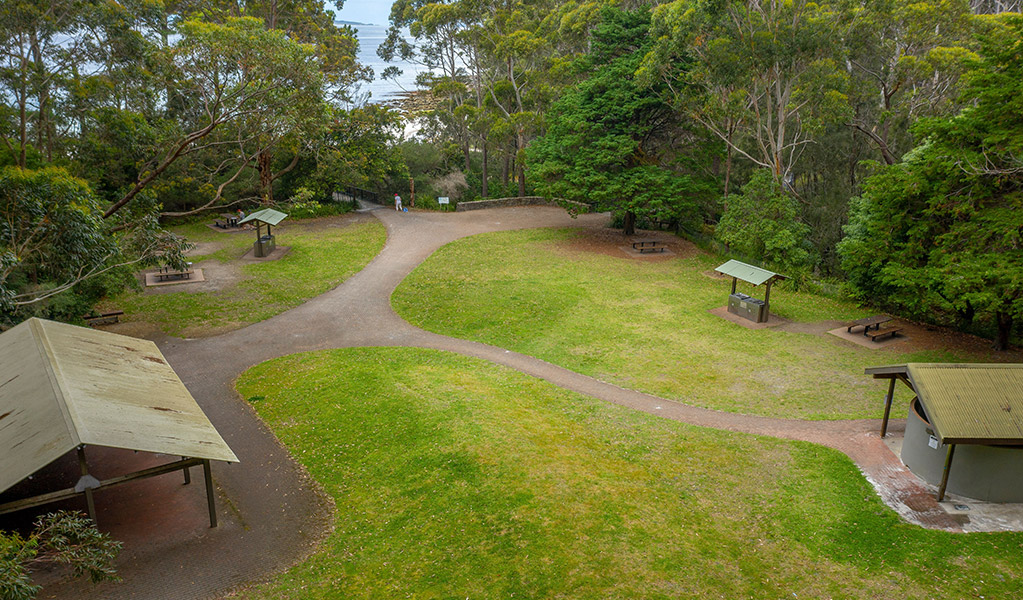  Aerial view of the grassy area and shelters at Greenfield Beach picnic area. Photo credit: John Spencer &copy; DPIE