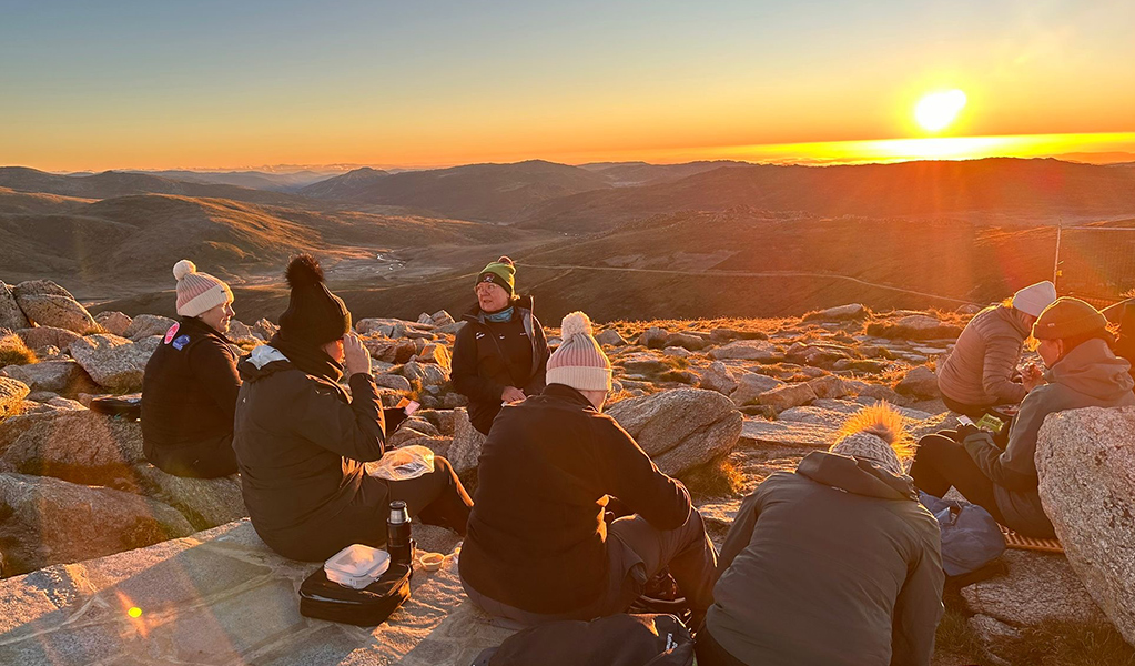 Women Embrace Adventure multi day tour group at the summit of Mount Kosciuszko at sunrise. Credit: Sharon Mackay &copy; Women Embrace Adventure