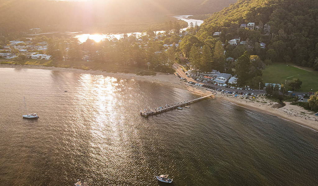 An aerial image of Patonga beach and wharf in Patonga, Central Coast. Credit: Jeremy Shaw &copy; Destination NSW 