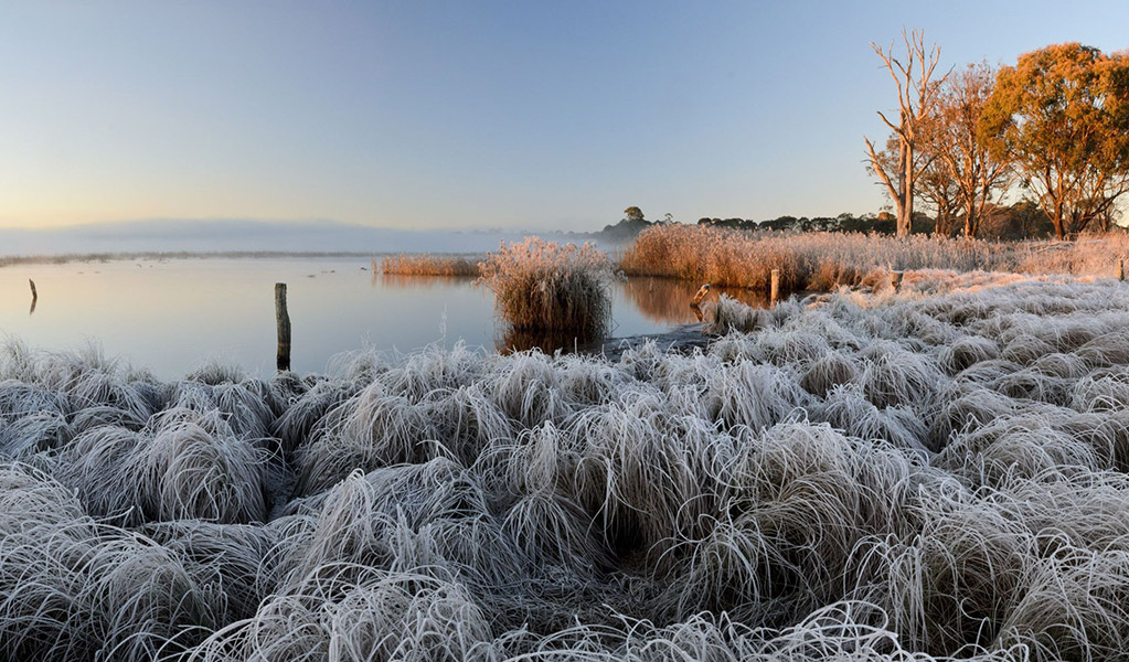 The Ramsar-listed Little Llangothlin Lagoon covered in frost as the sun rises. Credit: Shane Ruming / DCCEEW &copy; Shane Ruming