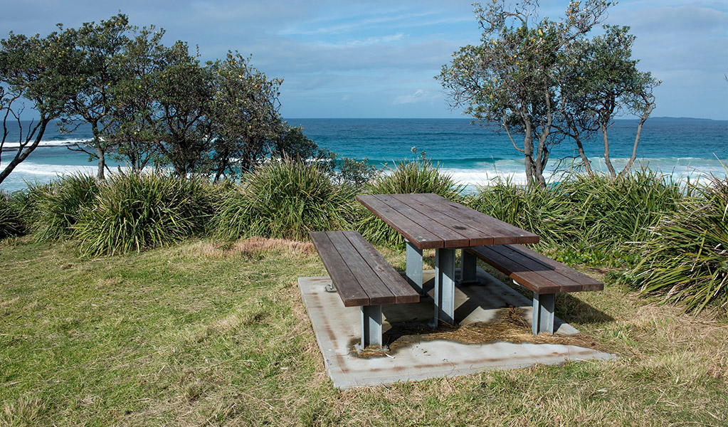 Picnic bench with views of the ocean at Stokes Island picnic area. Credit: Michael Van Ewijk &copy; DCCEEW