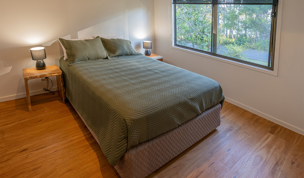 Bedroom in Depot Beach cabins. Photo: John Spencer &copy; DPIE