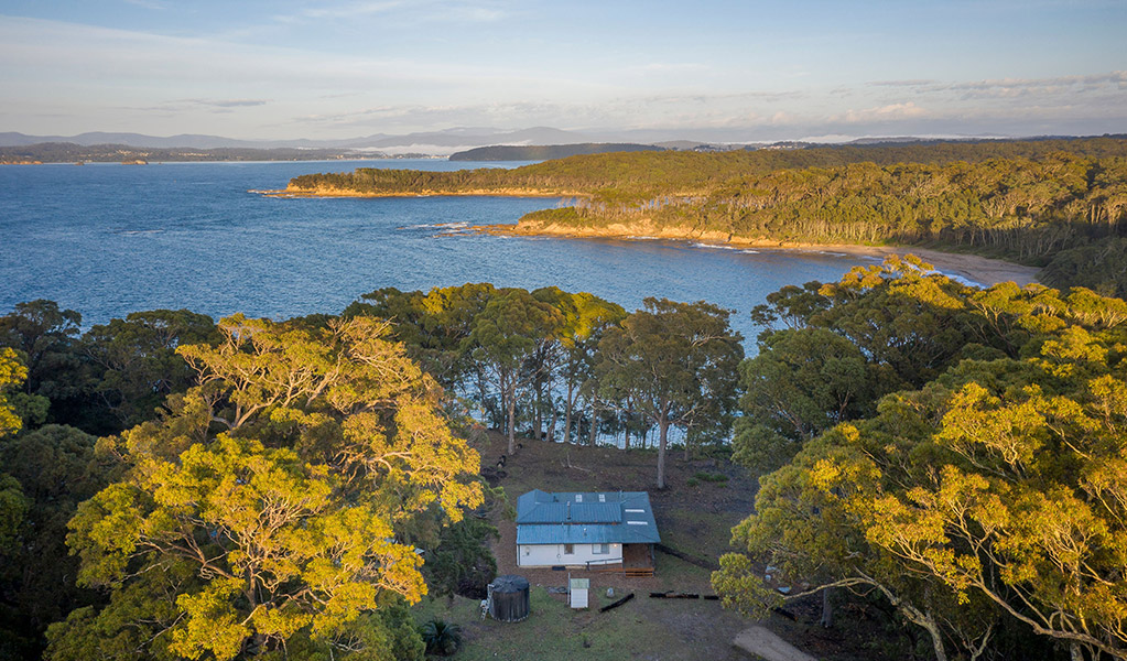 Aerial view of Judges House and the surrounding ocean and headlands. Photo: John Spencer &copy;DPIE