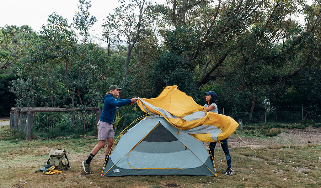 2 campers setting up their tent at Pretty Beach campground. Credit: Melissa Findley &copy; Melissa Findley