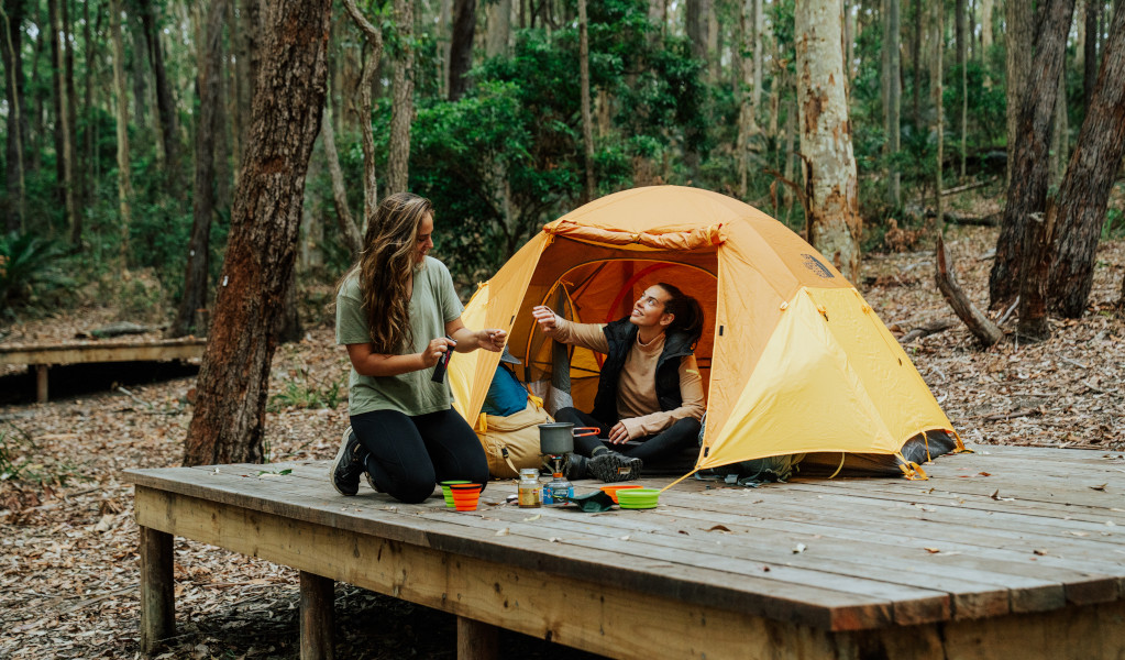 2 campers making coffee outside their tent. Credit: Remy Brand &copy; Remy Brand