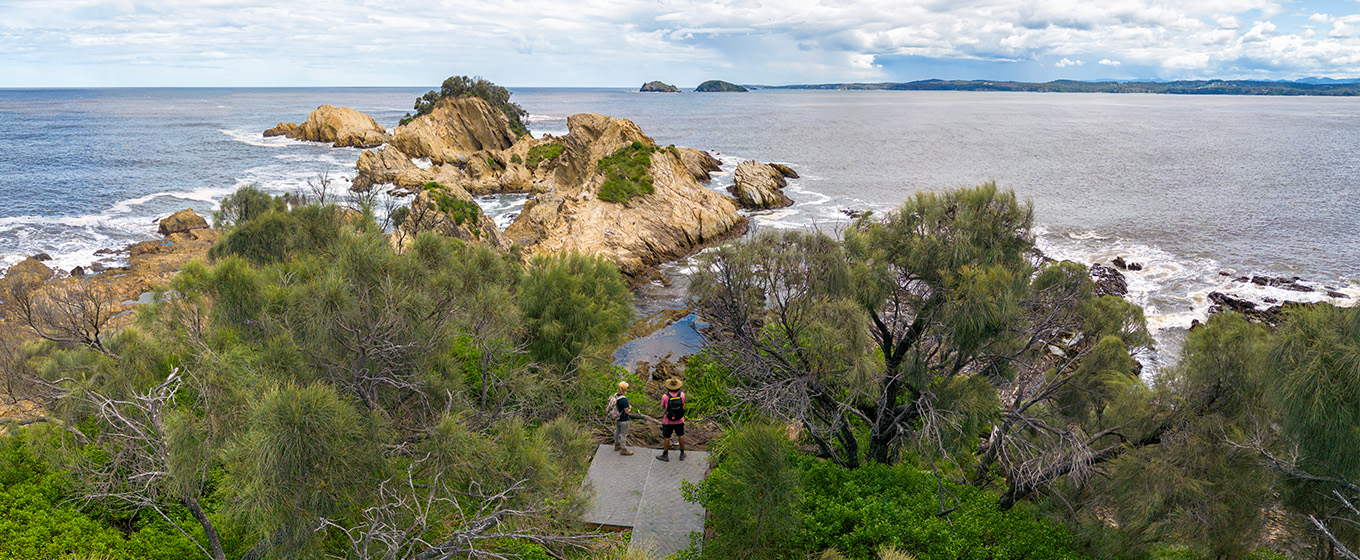 Walkers admiring rock features from the viewing deck near Yellow Rock. Credit: John Spencer &copy; DPE