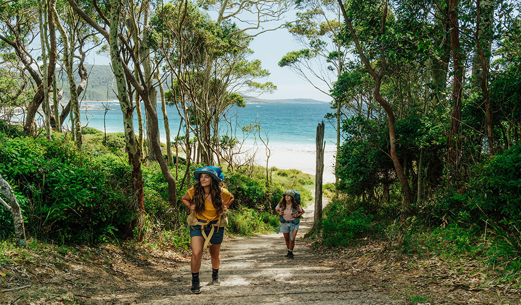 Walkers on the Murramarang South Coast Walk near Depot Beach. Credit: Remy Brand &copy; DCCEEW