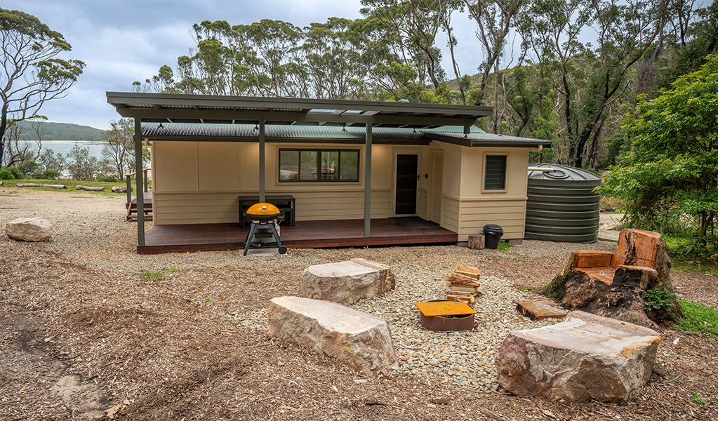 The back view of one of the Pebbly Beach shacks. Photo: John Spencer &copy; DPIE