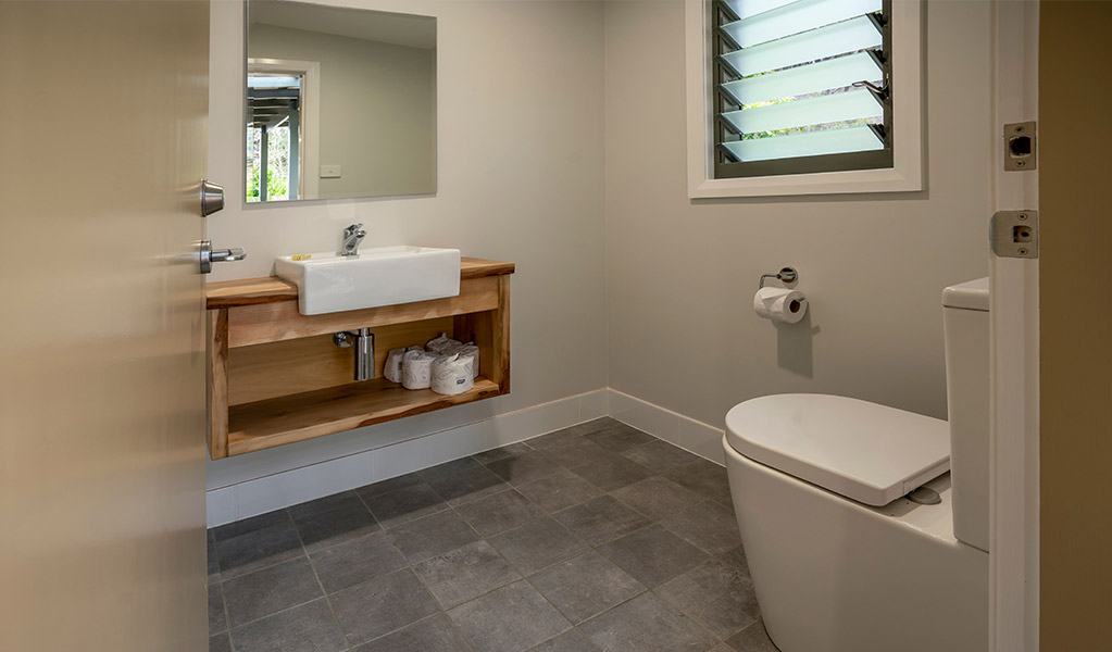 A bathroom at Pebbly Beach shacks. Photo: John Spencer &copy; DPIE