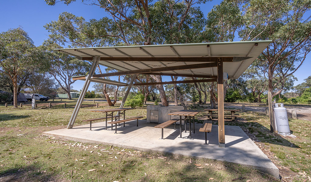 Picnic shelter with barbecues at Pretty Beach campground. Credit: John Spencer &copy; DCCEEW