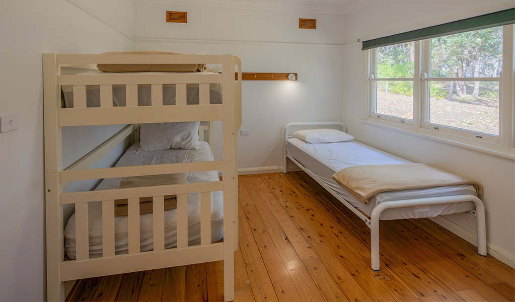 A bedroom with bunk bed at Yellow Rock Beach House. Photo: John Spencer &copy; DPIE