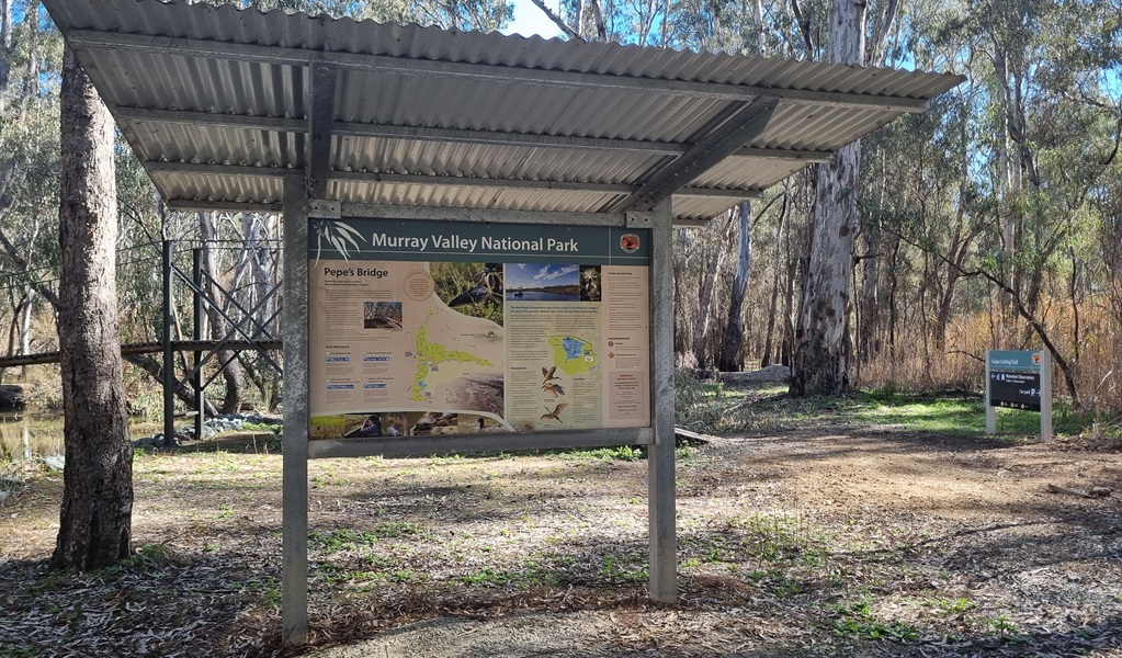 Pause for a while to read about the area when you visit Pepes Bridge picnic area, Murray Valley National Park. Credit: Amanda Hipwell &copy; DCCEEW