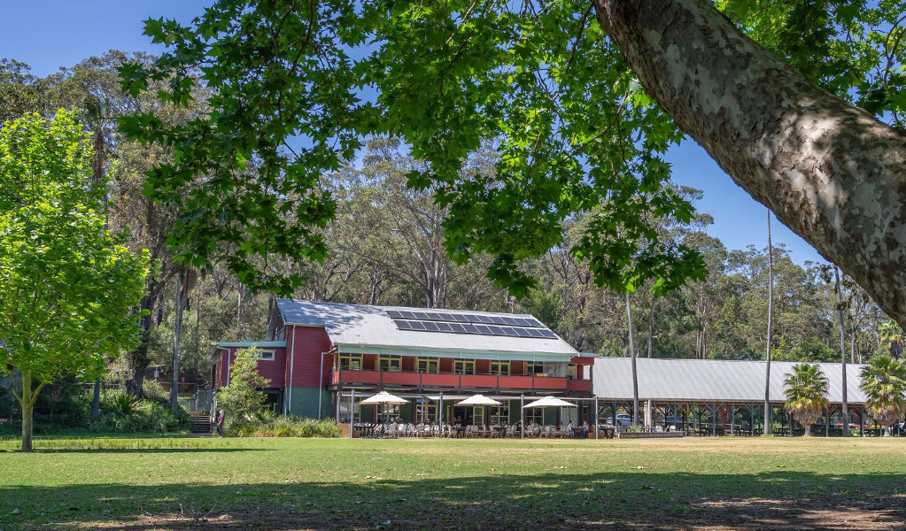 The exterior of Royal National Park Visitor Centre next to the historic Audley Dance Hall café and shady picnic areas in Audley Village. Credit: John Spencer &copy; DCCEEW