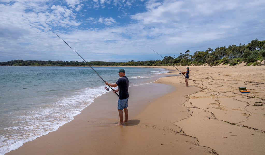 2 people beach fishing near Bonnie Vale campground in Royal National Park. Credit: John Spencer &copy; DCCEEW