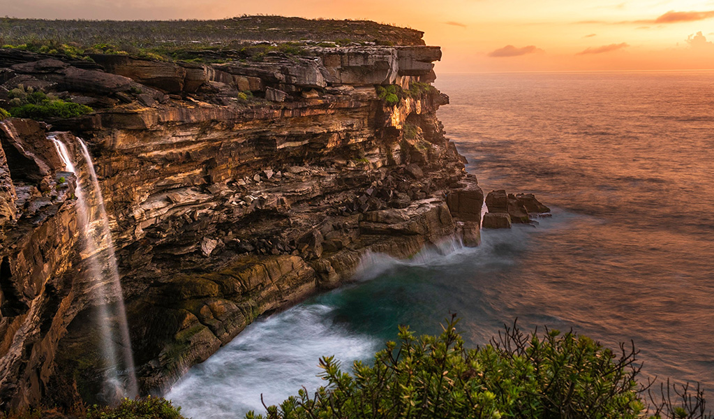 Sunrise at Eagle Rock and Curracurrong Falls in Royal National Park. Credit: Ethan Nance / DCCEEW &copy; Ethan Nance