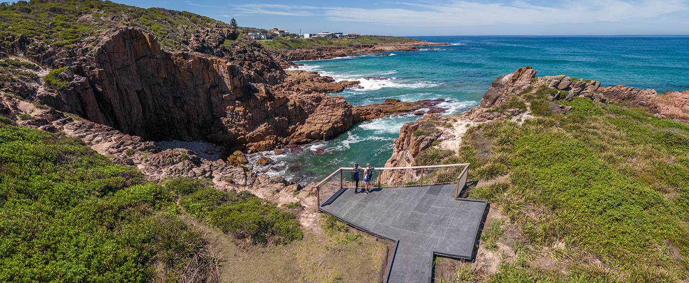 Aerial view looking down at the Iris Moore lookout platform facing the ocean and dramatic cliffs. Credit: John Spencer &copy; DPE