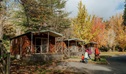 A family group arrive, walking up to Wombeyan Caves cabins, at the start of their stay at Wombeyan Karst Conservation Reserve. Credit: Remy Brand/DPE &copy; Remy Brand