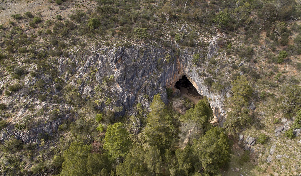 Aerial view of Victoria Arch and the surrounding limestone terrain sparsely covered in trees. Credit: John Spencer &copy; DPE