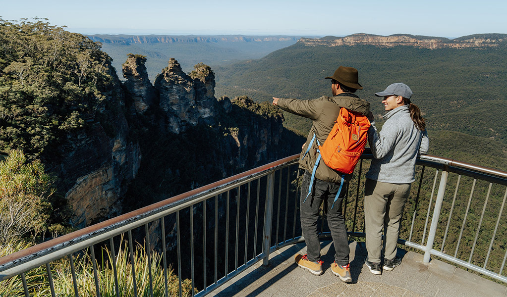 Visitors enjoying mountain views from Echo Point lookout. Credit: Remy Brand / DCCEEW